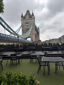 Tower Bridge in London with outdoor seating area – travel and PTSD preparation in public spaces.