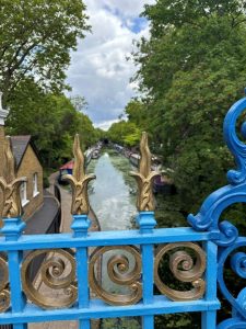 Little Venice canal in London with colorful boats – peaceful grounding travel destination for PTSD-friendly trips.