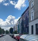 Notting Hill colorful houses in London – vibrant scenery representing joy and mindful walking for PTSD travelers.